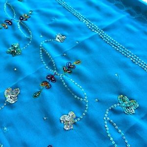 NWOT beautiful embroidered Indian saree for wearing or decorating.